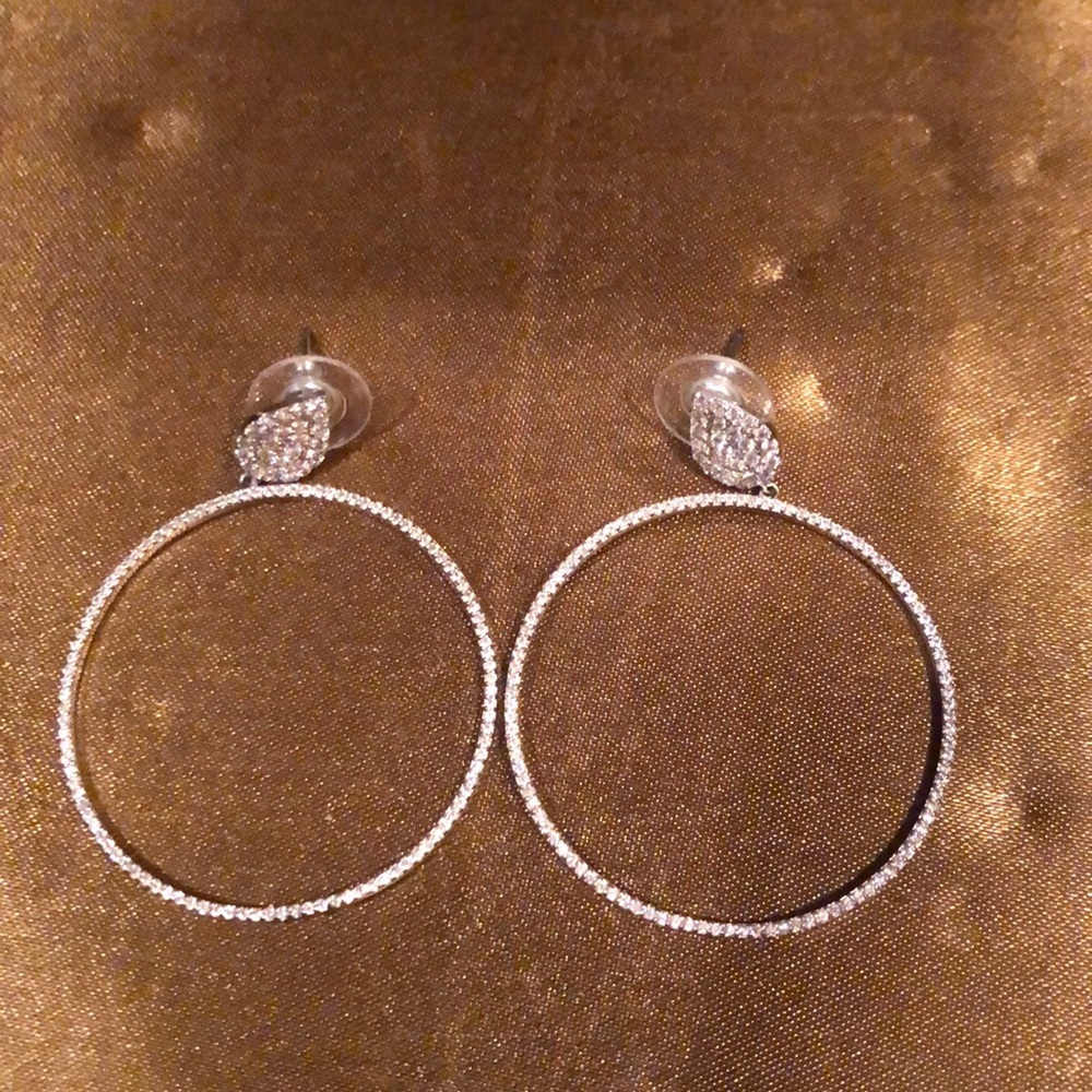 Faux diamond earrings. Never worn. In silver.